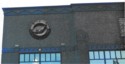 Photo taken Feb. 21998.  Four of these adorn each side of the two Southerly corners of the buidling on Glisan st.  Ordered by Richard W. Sunderleaf, Architect for the "Portland Knitting Company Jantzen".  Current Address in 2018 is 1935 N.E. Glisan St.  Order #128 Glaze "Polychrome" in Leonard Martins order book for Columbia Terra Cotta Co.